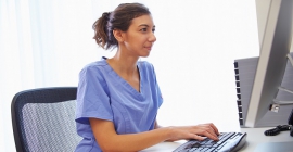 nurse working on a computer